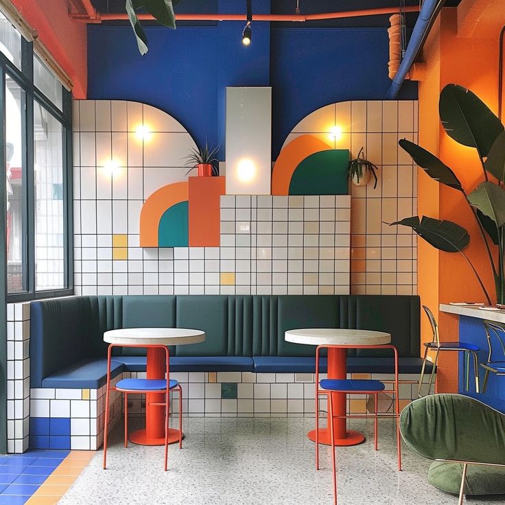 the interior of a restaurant with brightly colored booths and tables, along with potted plants