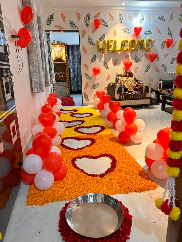 a room decorated with balloons and decorations in the shape of hearts, flowers, and leaves