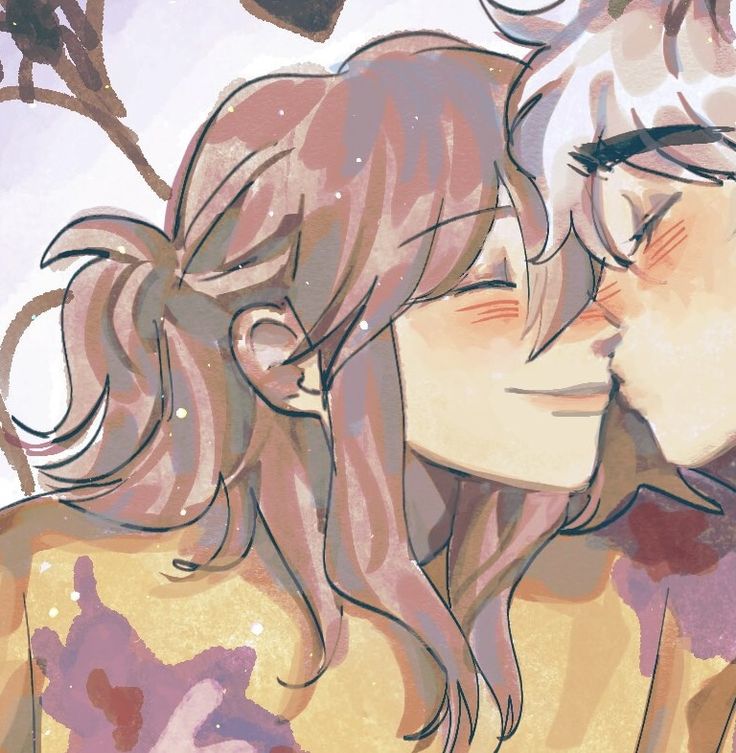 two people are kissing each other in front of a tree with leaves and branches on it