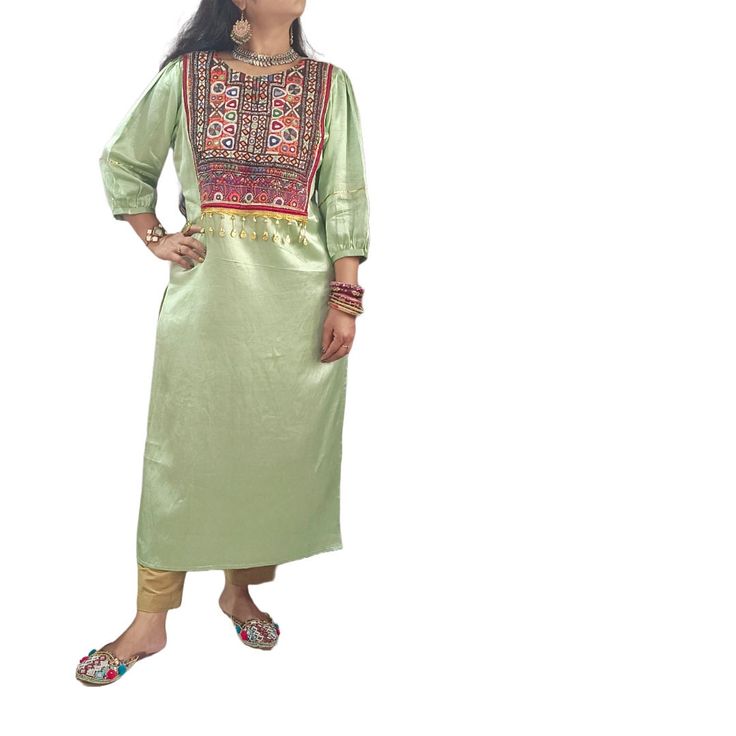 Experience Fashionable elegance with this Mashroo Cotton Silk Kutchi hand embroidered mirror work Jacket crafted from superior cotton silk blend for comfort and breathability. The Kutchi hand embroidered on its front crafted by artisans of Kutch which reflects of colourful Kutch. Look & feel your best with this timeless piece. Semi-stitched Embroidered Green Kurta, Semi-stitched Green Kurta With Embroidered Border, Green Semi-stitched Kurta With Embroidered Border, Green Salwar Kameez With Embroidered Border In Art Silk, Green Art Silk Salwar Kameez With Embroidered Border, Green Kurta With Embroidered Border For Navratri, Festive Green Dress With Embroidered Border, Pista Green Embroidered Straight Kurta, Green Straight Kurta With Embroidered Border