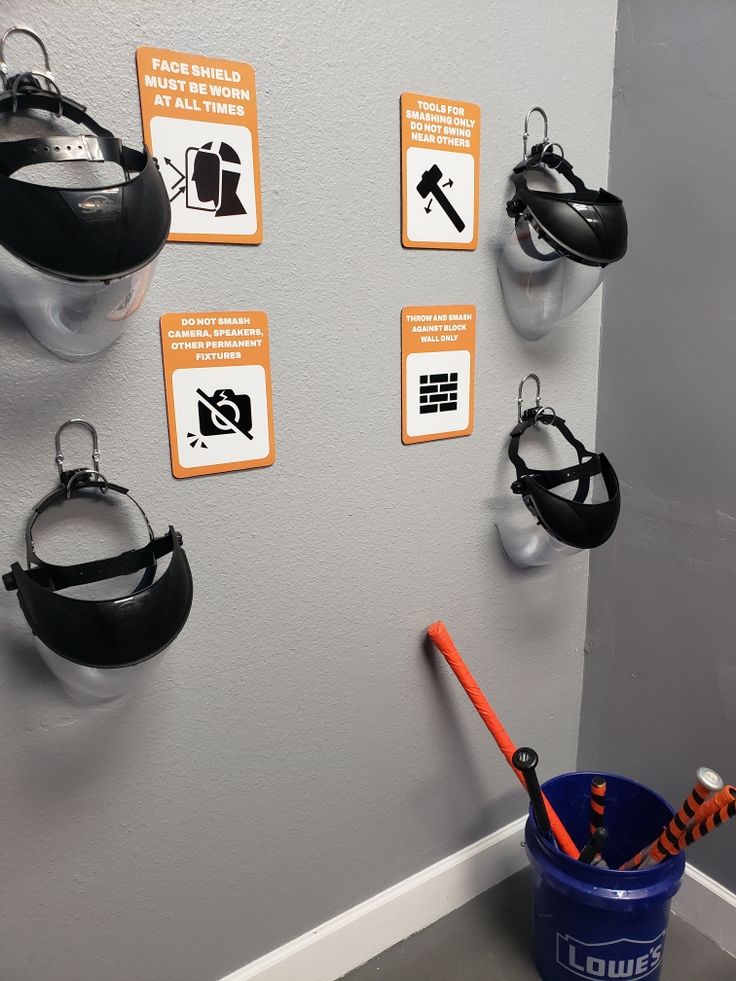 there is a bucket and several different items on the wall