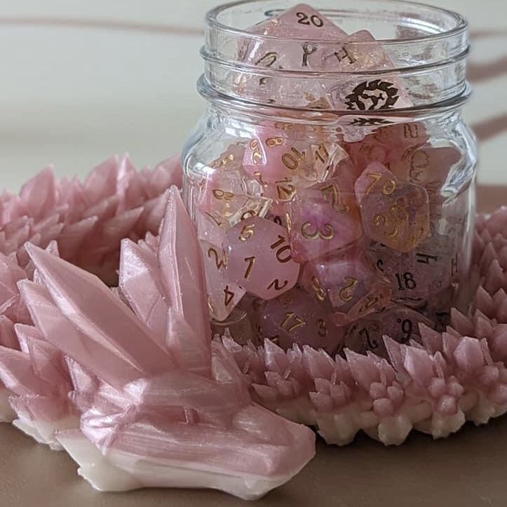 a jar filled with lots of pink dice