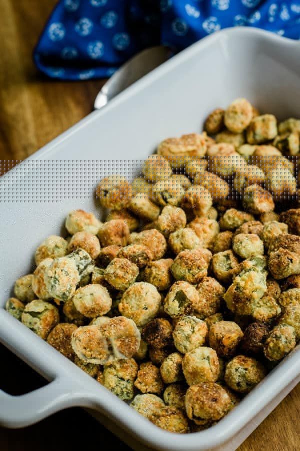 a white dish filled with crumby oven fried okra