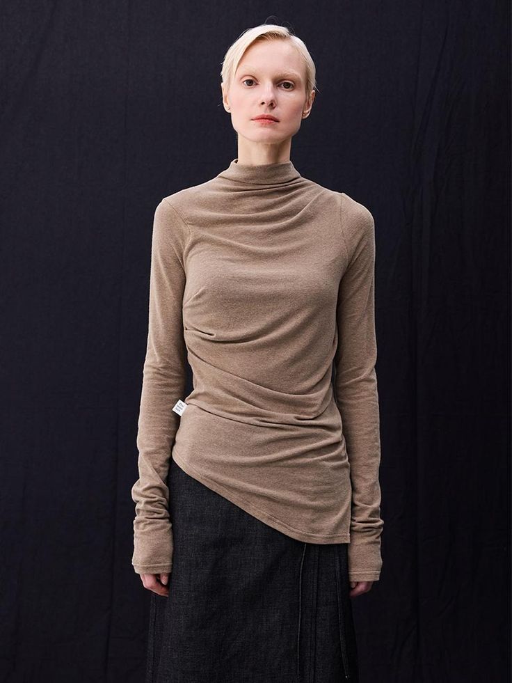 This is a half turtleneck design with long sleeves and shirring sleeves. The asymmetric length creates a trendy mood and the slim fit makes you look slimmer. Added slit to the sideCreate a three-dimensional silhouette by adding tucks to the shoulders and chest.Soft texture made of wool-containing fabricAvailable in 5 colors: Skin, Brown, Black, Sky, Grey*The color of the product may vary depending on the resolution and calibration settings of the monitor and device being used. Fashion Silhouette, Black Sky, Fall Fits, Khaki Color, Get Dressed, Three Dimensional, Top Styles, Fashion Photography, Long Sleeve Tops