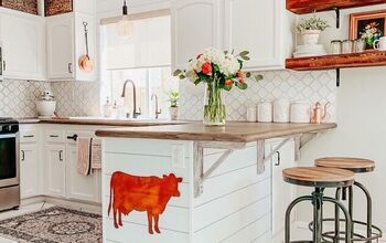 a cow painted on the counter in a kitchen