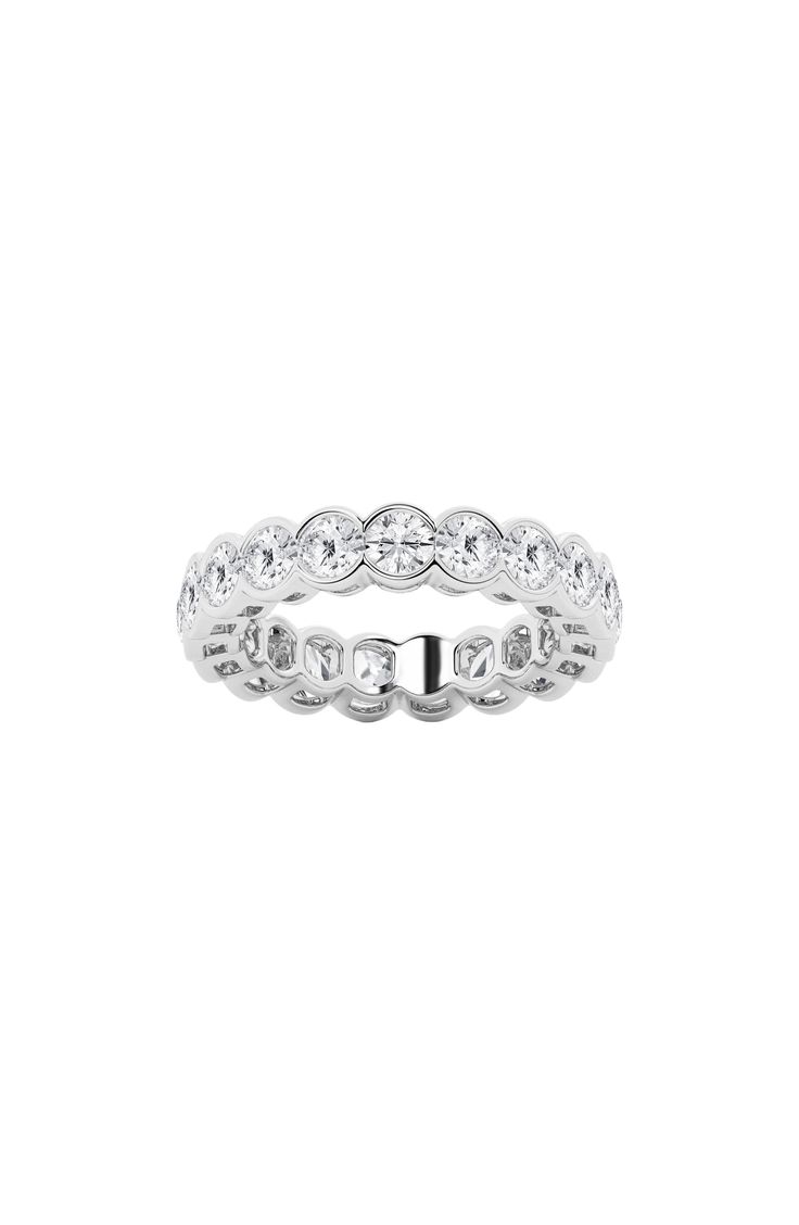 Celebrate a milestone with a stunning eternity band ring crafted from 14-karat gold and adorned with round-cut lab-created diamonds for luxurious sparkle. Total diamond weight: 3.00 ctw Color: G+ Clarity: VS 14k gold/lab-created diamond Imported Diamond Guide Dazzling Round Platinum Eternity Band, Dazzling Diamond Cut Eternity Band, Lab Grown Diamond Eternity Band For Promise, Round Lab Grown Diamond Eternity Band Promise Ring, Dazzling Lab-grown Diamond Eternity Band, White Diamond Cut Round Eternity Band, Anniversary Eternity Band With Lab-grown Diamonds, White Gold Moissanite Eternity Band, Lab Grown Diamond Eternity Band With Diamond Cut