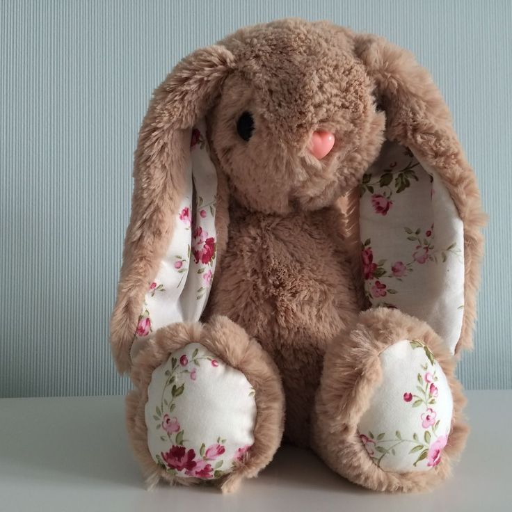 a stuffed rabbit sitting on top of a table