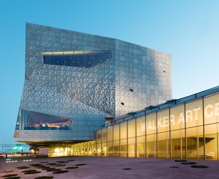 the exterior of a modern building at dusk