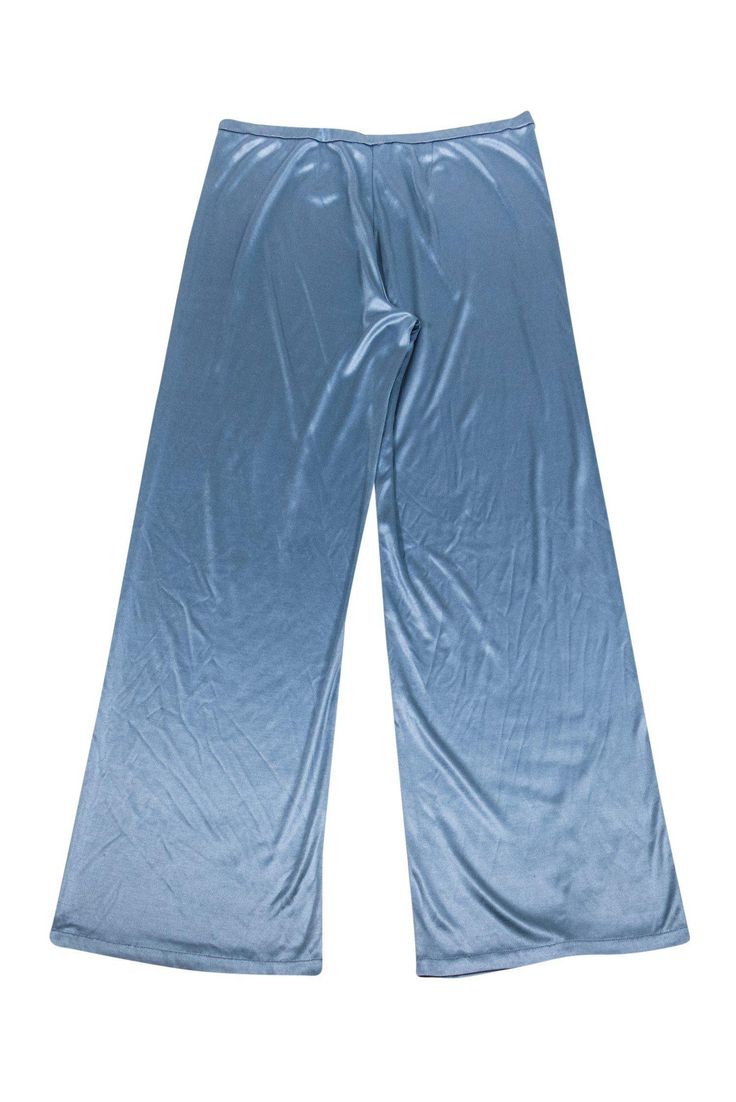 Stretchy and lightweight wide leg pants by Emilio Pucci. Wear these pants day to night effortlessly. Pair with your favorite silk blouse, wedges, and oversized sunnies for a groovy-chic look. Size 10 - IT 44 100% Silk Made in Italy Wide leg Elastic waistband Small mark on front Waist 29" Hips 36" Total length 39.5" Inseam 31" Blue Wide Leg Pants For Evening, Blue Wide-leg Evening Bottoms, Blue Wide Leg Evening Bottoms, Evening Wide Leg Blue Bottoms, Blue Wide Leg Bottoms For Evening, Blue Wide Leg Pants For Summer Party, Blue Straight Leg Evening Bottoms, Chic Blue Wide Leg Loungewear Pants, Versatile Blue Wide Leg Pants For Summer