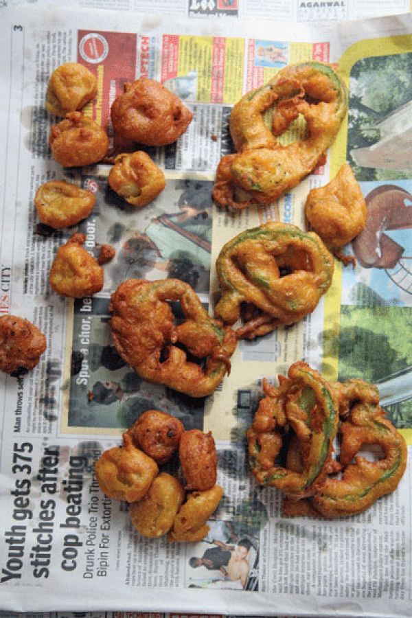 some fried food sitting on top of a newspaper