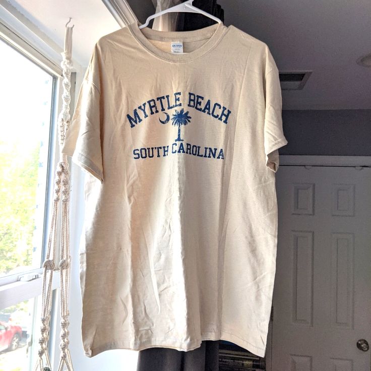 Nwot (New Without Tags) South Carolina Myrtle Beach Palmetto Tee Shirt! Cream / Nude / Beige Color With Navy / Blue Print. Bundle Any 3 Items Marked With A "" To Receive A 3 For $15 Discount (+$5 For Each Additional Item After 3 With A "" In The Listing)! Thanks For Looking!! Summer Beige Crew Neck Top, Cream Cotton Vacation Tops, Cream Cotton Tops For Vacation, Cream Crew Neck Top For Vacation, Beige Cotton Shirt For Vacation, Beige Cotton Tops For Beach Season, Beige Crew Neck Top For Vacation, Cream Cotton Beach Tops, Cream Cotton Top For The Beach