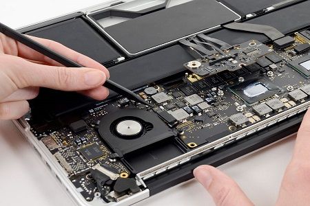 someone is removing the motherboard from their laptop