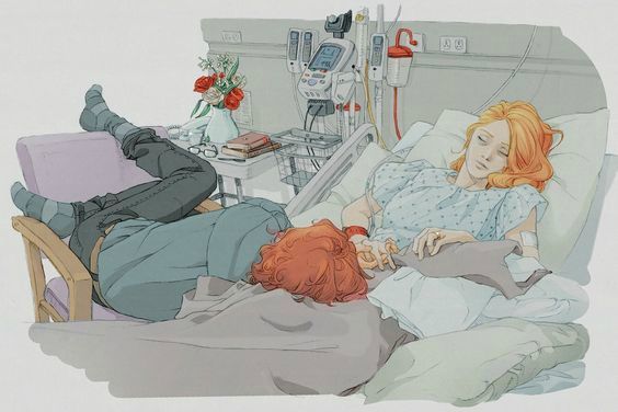 two people laying in a hospital bed next to each other