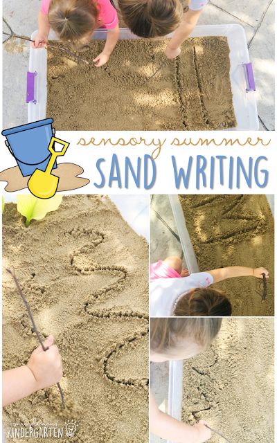 two children are writing in the sand with letters and numbers on it, while another child is