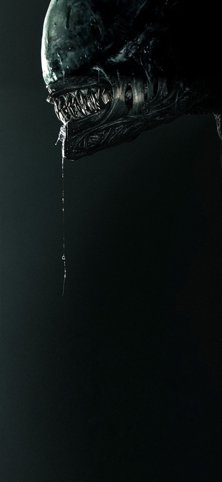 a close up of a person holding an object in their hand with water dripping from it