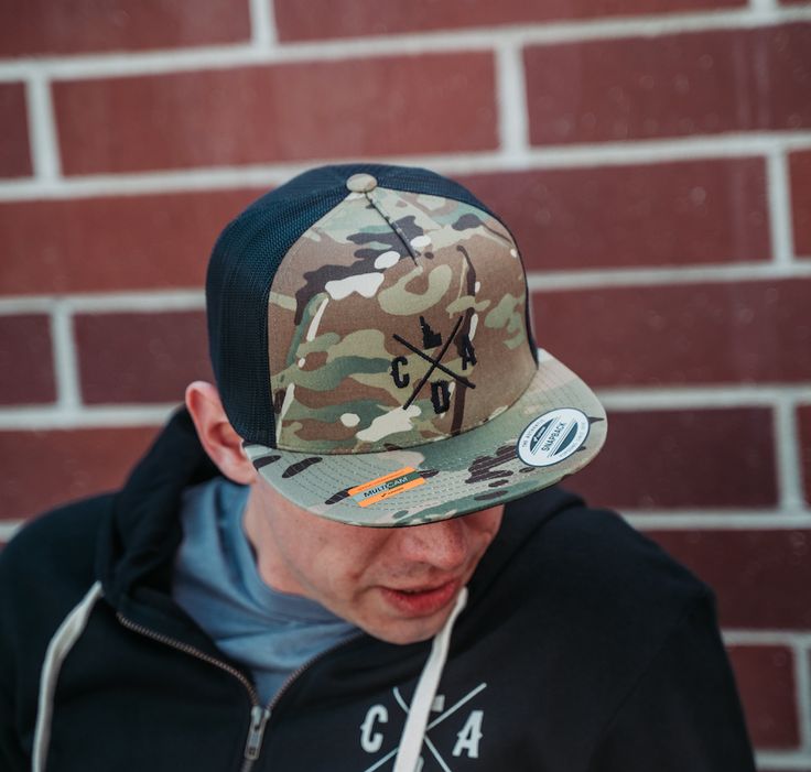 Check out this flat bill camo hat! Featuring our locally embroidered logo on the front. Military Snapback Hat With Flat Bill For Outdoor, Military Style Snapback Hat With Flat Brim, Casual Snapback Hat With Flat Crown For Outdoor, Casual Camouflage Snapback Hat With Flat Brim, Military Camouflage Trucker Hat With Flat Brim, Military Style Camouflage Trucker Hat With Flat Brim, Casual Camouflage Trucker Hat With Flat Brim, Casual Camouflage 5-panel Snapback Hat, Camouflage Snapback Baseball Cap For Streetwear