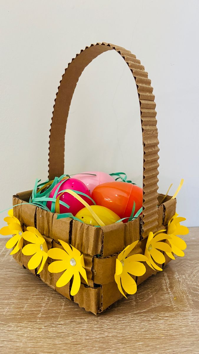 an easter basket with eggs in it on a table