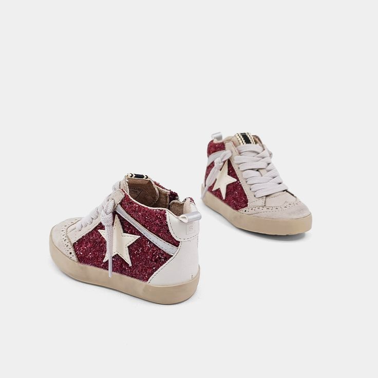 Check out PAULINA! These hi-top sneakers offer a twist on classic basketball shoes with unique color and texture combos. Match your little one's outfit with our Mommy and Me collectionglittery body, faux leather and suede embellishments, durable rubber sole - perfect for both.