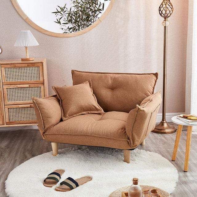 a living room filled with furniture and a round mirror on the wall over a white rug