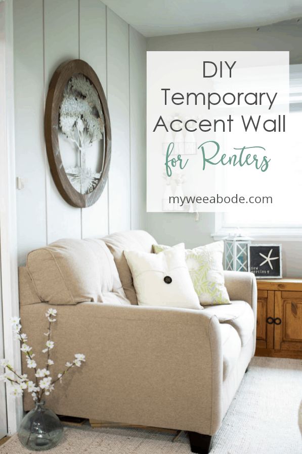 a living room with white walls and wood trimmings, the words diy temporary accent wall for renters