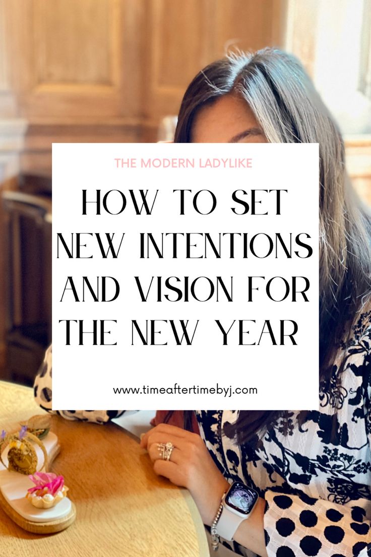 a woman sitting at a table with a sign that says how to set new intentionss and vision for the new year