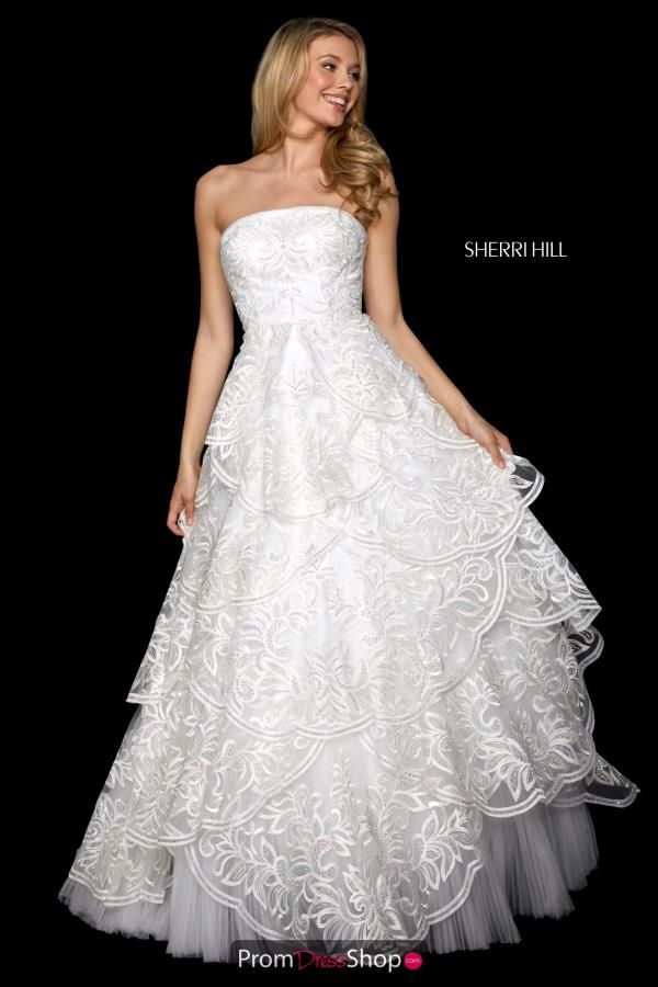 a woman in a white dress standing on a black background with the words sherri hill