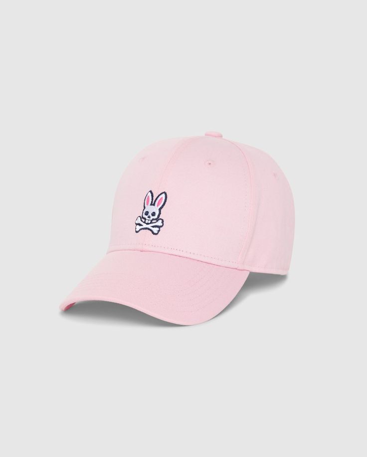 The MENS CLASSIC BASEBALL CAP - B6A816A1HT by Psycho Bunny is a timeless light pink baseball cap, meticulously crafted from 100% cotton, and showcased against a plain background. It features an embroidered design on the front, depicting a white bunny head with crossbones underneath. The bunny sports pink ears and black outlines, imparting a playful touch to this classic accessory. Embroidered Bunny, Bunny Man, Bunny Logo, The Best Outfits, Best Accessories, Best Outfits, Cotton Twill, Style Guides, Baseball Cap