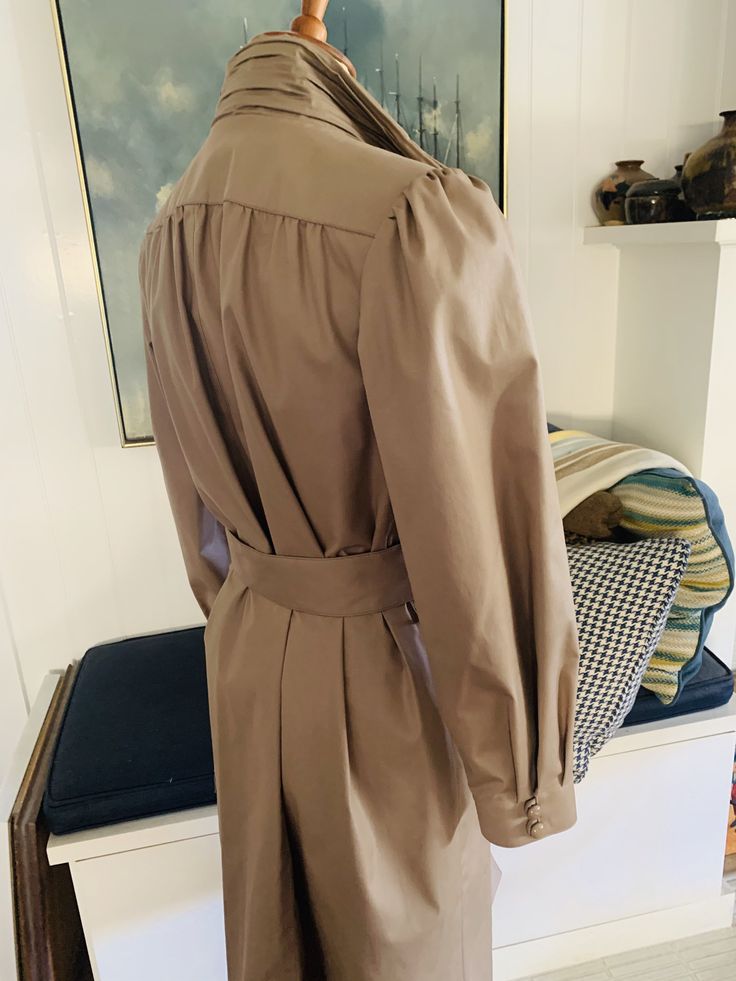 "Vintage 80's London Fog Trench Coat This weather proof piece is in mint condition Designed with a pleated high neck this coat looks incredible on and reminds me of the statement blouses of that era. Coat measures 43\" long with 23\" sleeve when lying flat there's 15\" between shoulder seams and 19\" in the chest 17\" in the waist sized 8 Pet SHIPPING estimates are based upon USPS Priority Flat rate boxes. Please feel free to contact me with your zip code to get an accurate shipping cost. **INTE Spring Pleated Long Sleeve Outerwear, Chic Long Sleeve Pleated Outerwear, Chic Pleated Spring Outerwear, Chic Pleated Long Sleeve Outerwear, Pleated Formal Outerwear For Fall, Formal Pleated Outerwear For Fall, Pleated Long Sleeve Formal Outerwear, Fall Pleated Outerwear For Office, Pleated Outerwear For Fall