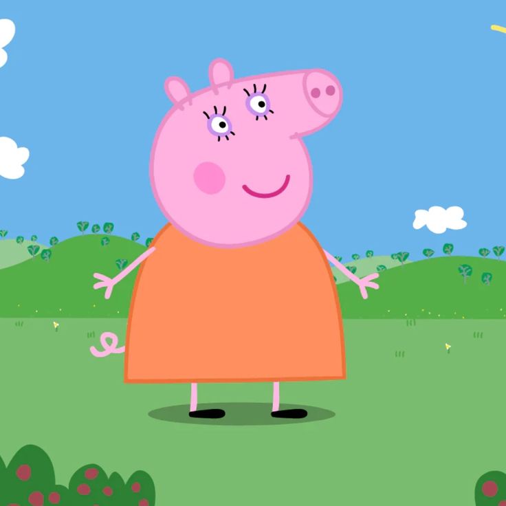 peppa pig is standing in the grass