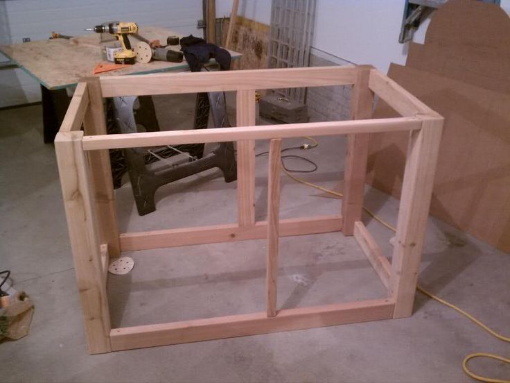 an unfinished window frame in the process of being made into a house or office building