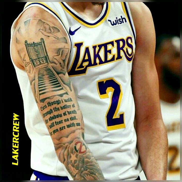 a basketball player with tattoos on his arm