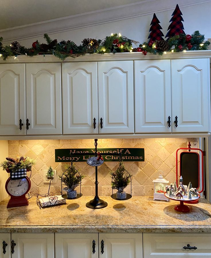 the kitchen counter is decorated with christmas decorations