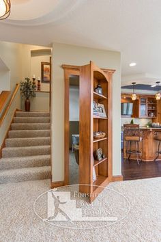 an open living room and kitchen area with stairs