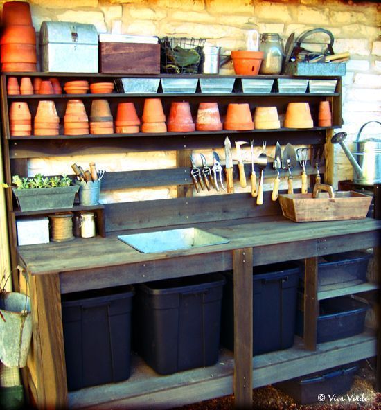 an outdoor kitchen with pots, pans and utensils