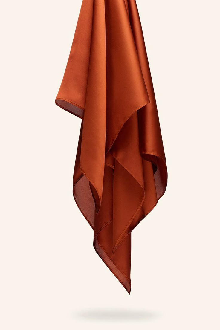 an orange towel hanging from a hook