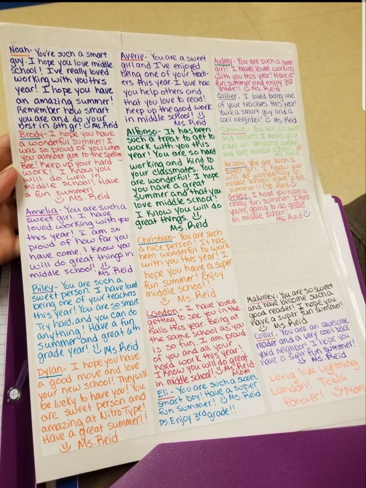 someone is holding up a piece of paper with writing on it and the words are written in different colors