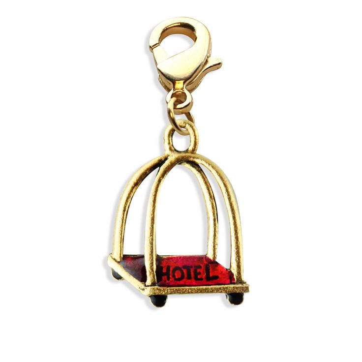 a gold charm with the word hotel on it's side and a red box in the middle