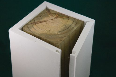 an open white box with wood slices in it