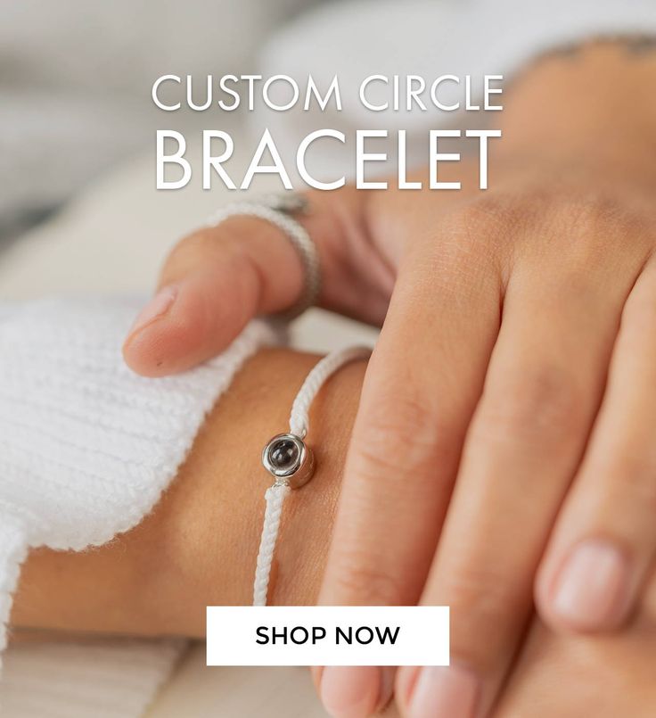 a woman's hand is wrapped in white string and has a ring on it that says, custom circle bracelet