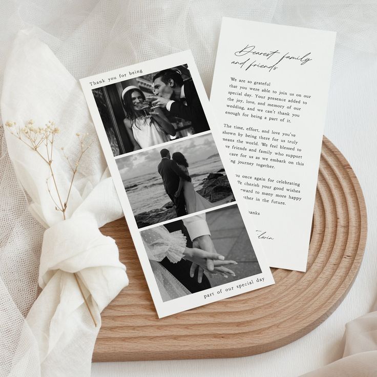 a couple's wedding photos are displayed on top of a wooden tray with white cloth