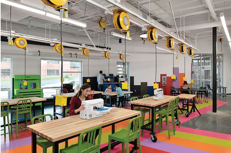 an office with colorful flooring and lots of desks