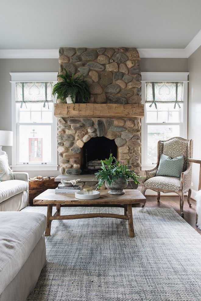 a living room filled with furniture and a fire place