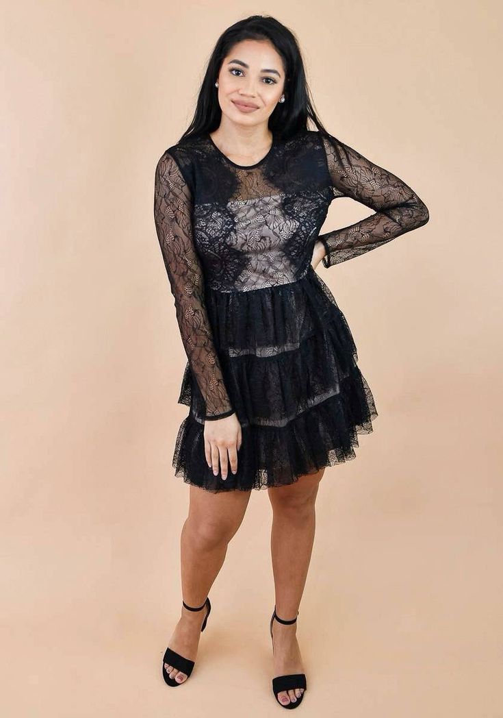 Be prepared to turn heads when you step out in this lace ruffle hem long sleeve dress! This sultry number will leave 'em wanting more with its long sleeves covered in sheer lace. Featuring a sheer bodice with a nude insert. Tiered layers of lace sitting perfectly at the waist, make this dress the perfect party or holiday outfit. Fully lined. Nude insert by the bust area. Hidden Back Hook & Zipper Closure 100% Nylon Partially Stretchy Runs True to Size Our model Ashley is wearing a size Small Sheer Lace Night Out Dress, Sheer Lace Dress For Night Out, Fitted Tiered Lace Dress With Lace Trim, Long Sleeve Lace Mini Dress With Scalloped Lace, Sheer Mini Length Lace Dress For Date Night, Long Sleeve Scalloped Lace Dress, Tiered Lace Dress With Ruffle Hem For Party, Fitted Tiered Lace Dress With Scalloped Lace, Fitted Tiered Scallop Lace Dress