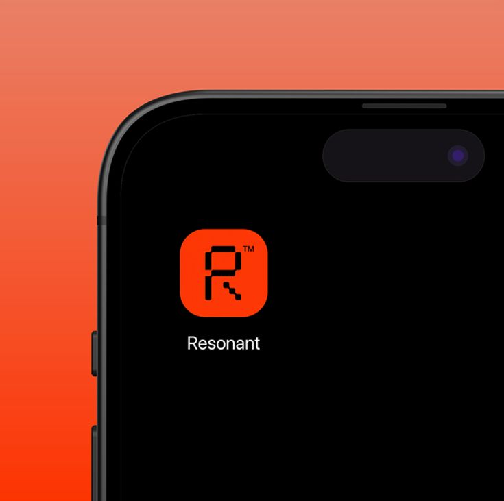 an orange and black phone with the text ressantt on it's screen