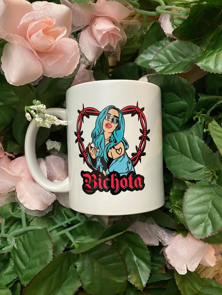 a white coffee mug with the words ricolo on it surrounded by pink flowers and green leaves