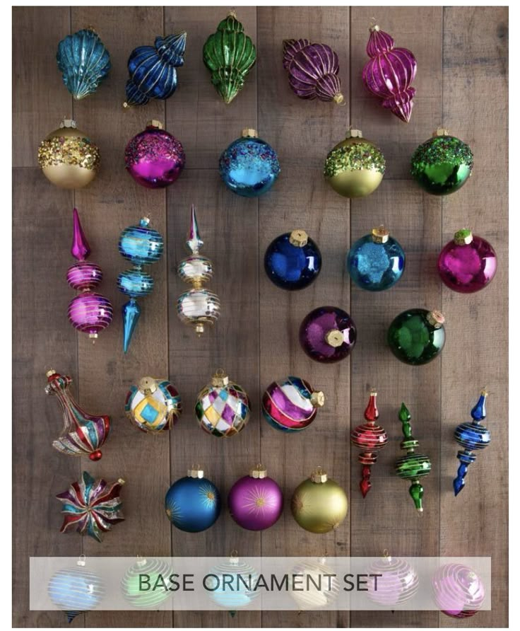 many different colored ornaments on a wooden surface