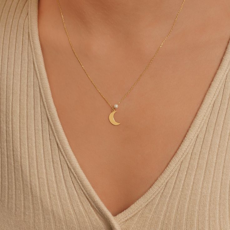 This enchanting 14K solid gold necklace features a delicate crescent moon pendant adorned with a lustrous freshwater pearl, blending elegance with celestial charm. The adjustable chain length of 16'' to 18'' ensures a perfect fit. An ideal gift for mom, adding a touch of grace and sophistication to any outfit. ✨ PRODUCT DETAILS ✨ * Material: 14K Solid Gold (real solid gold, no gold-filled or no gold plated material) * Choice of Gold Color: Yellow Gold, Rose Gold, White Gold * Necklace Length: 18 Elegant Yellow Gold Charm Necklace With Moon Phase, Elegant Yellow Gold Moon Phase Charm Necklace, Elegant Half Moon Charm Necklace, Minimalist Gold-plated Necklace With Moon Charm, Gold Moon-shaped Tarnish-resistant Necklace, Elegant Moon-shaped Necklace With Pearl Pendant, Gold Moon-shaped Celestial Charm Necklace, Crescent Moon Necklace Gold, Brass Moon-shaped Necklace With Moon Charm