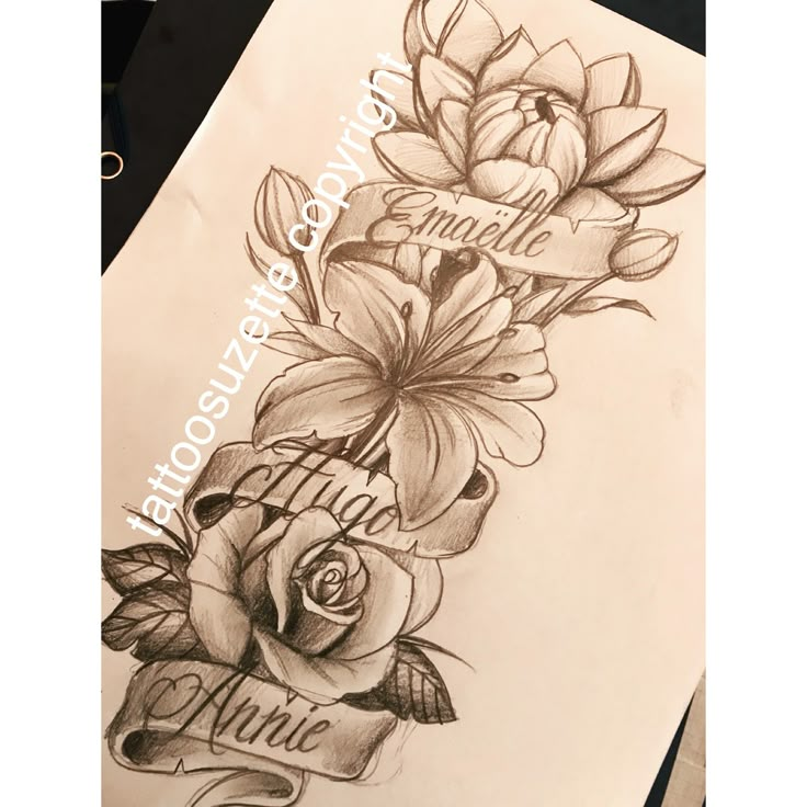 a tattoo design with flowers and the word love written in cursive writing on paper