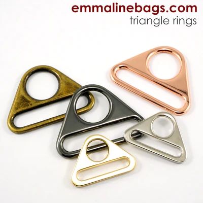 four metal triangle shaped rings on a white background with the text emailine bags com triangle rings