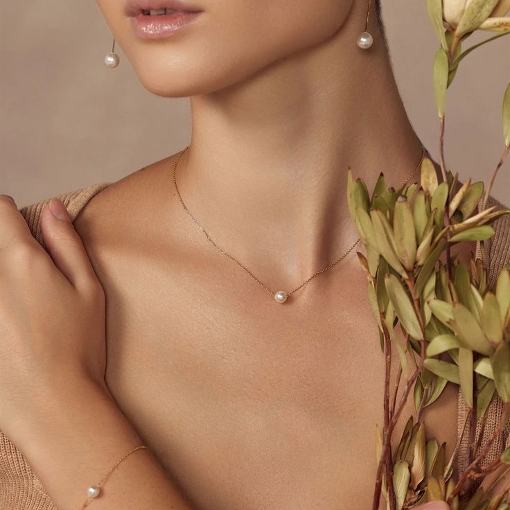 Do you want to find minimalism at its best? Then you must grab our Abby Single Pearl Necklace. It’s exquisitely dainty, featuring a delicate chain with a single glossy pearl adorning it. This dainty necklace lies prettily on your single neck and is so lightweight you’ll easily want to wear it all day. - Gold plating over Sterling Silver- Swarovski pearl- Adjustable chain length is 14" to 16"- Available in Yellow Gold, White Gold, and Rose Gold Luxury Dainty Pearl Chain Necklaces, Dainty Luxury Pearl Chain Necklaces, Affordable Pearl Anniversary Necklaces, Cheap Everyday Pearl Pendant Jewelry, Cheap Delicate Necklaces For Anniversary, Luxury Teardrop Pearl Necklace In Delicate Style, Affordable Elegant Pearl Drop Necklace, Cheap Single Strand Elegant Pearl Necklace, Luxury White Gold Pearl Necklace For Gift